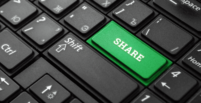 Green share button on black keyboard