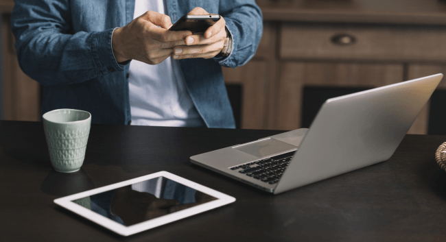 digital tablet and coffee mug on kitchen counter